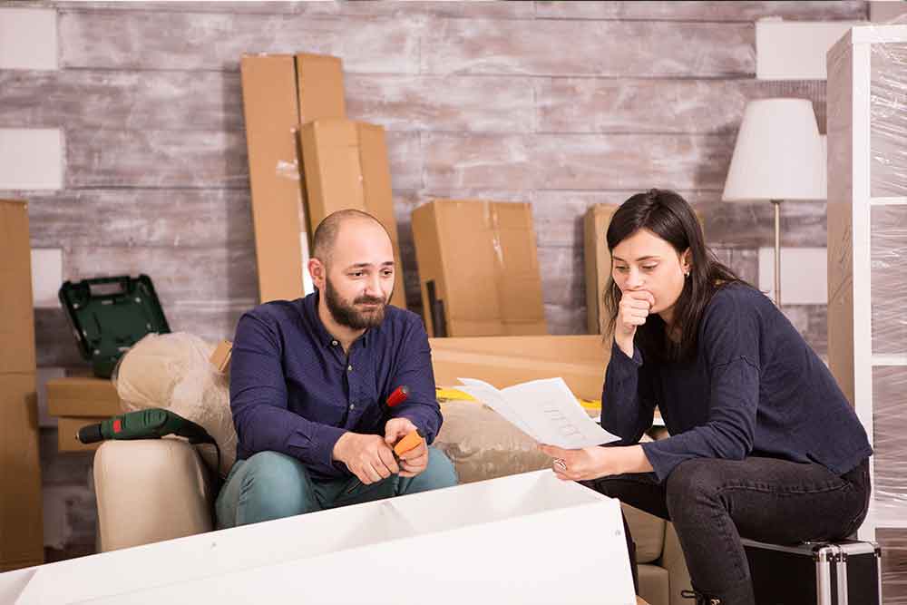 man and woman stressed about bill