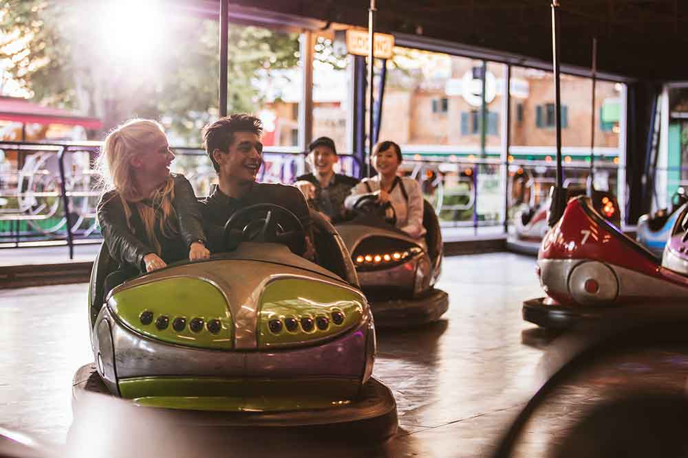 People enjoying in dodging car at ferrari world