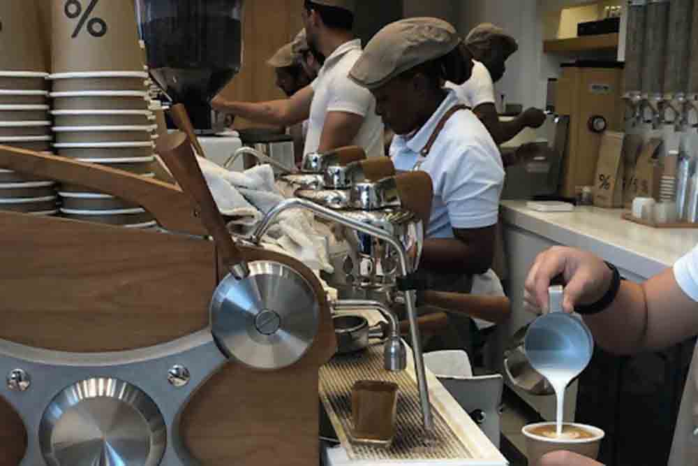 Coffee and snacks served on a table 