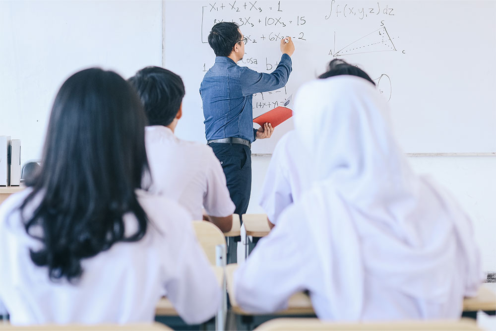 Students taking lectures in school