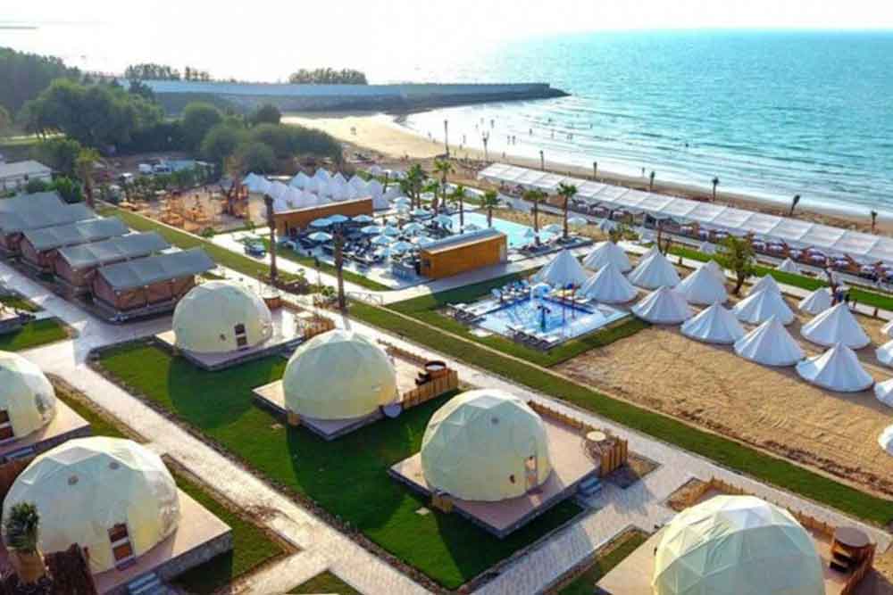 An amazing view of dome tents near the beach