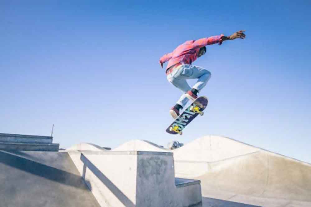 Boy jumping with a skateboard