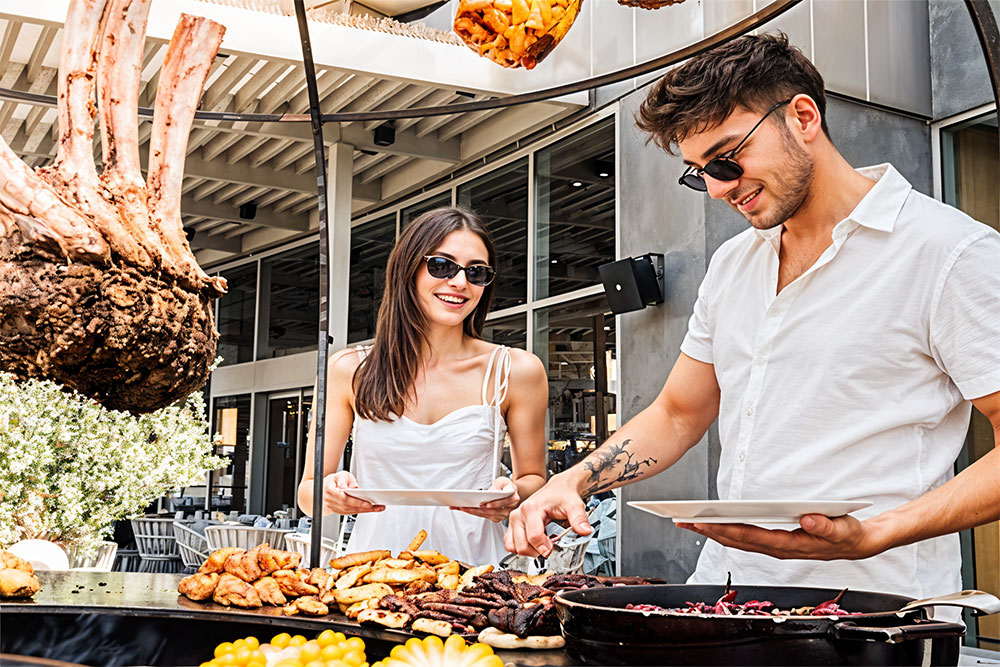 A couple getting food for brunch at Brasserie 2.0