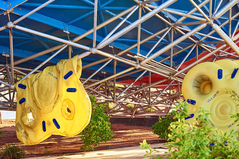 Inflatable yellow tubes hanging at Atlantis water park