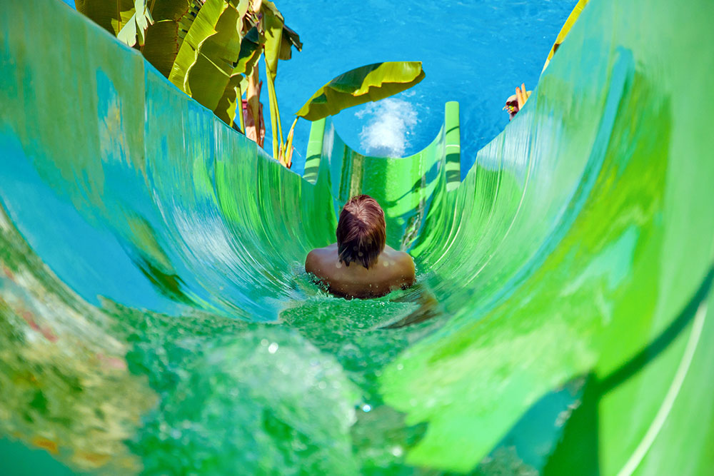 People enjoying the thrilling slides at Atlantis water park