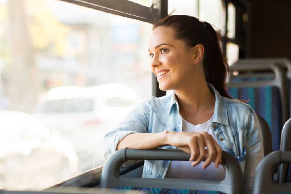 A passenger woman travelling in a bus