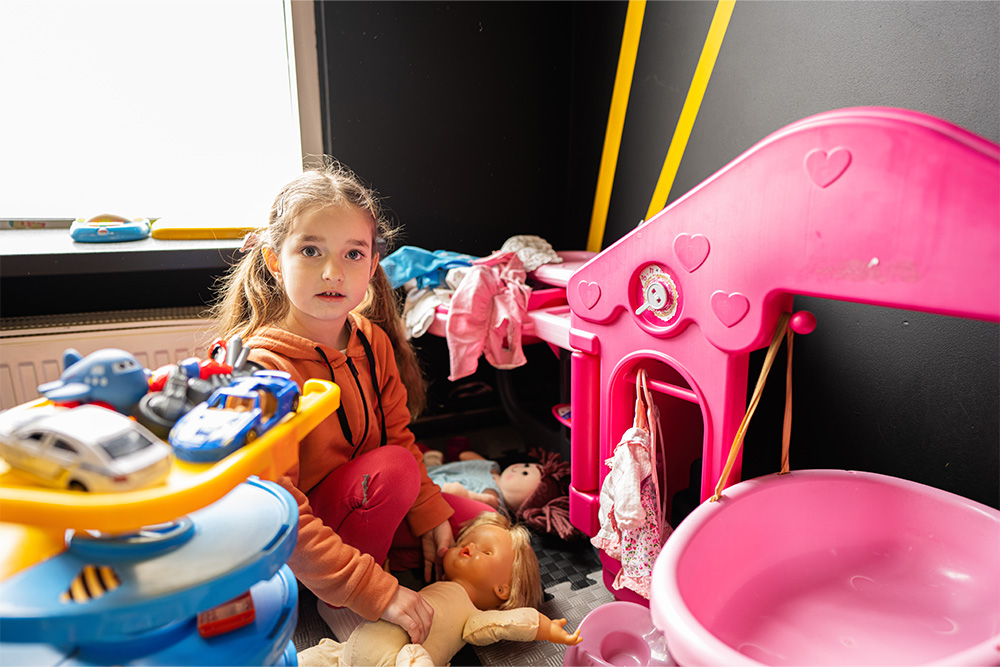 Little girl playing in the nursery play area