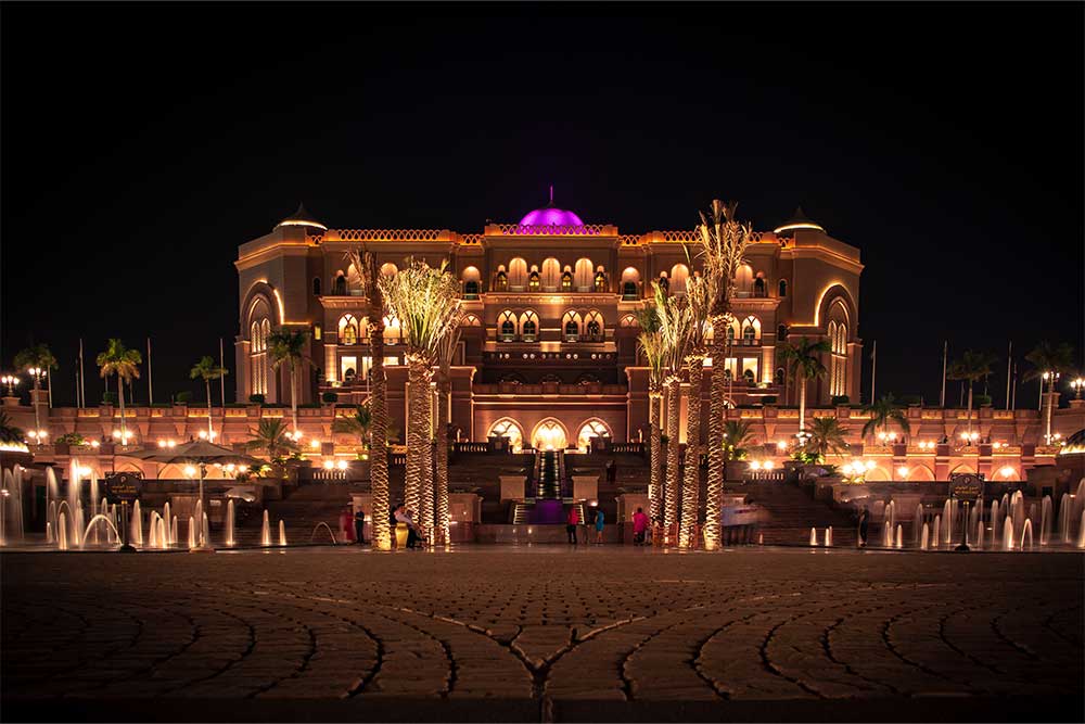 water fountains near Emirates Palace at night in Abu Dhabi