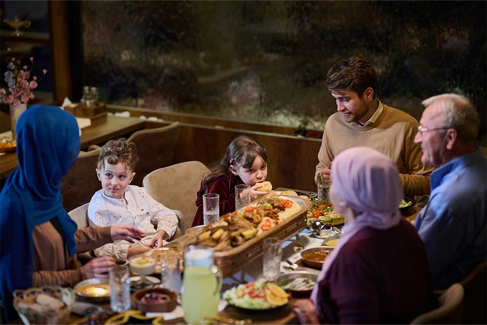  European Islamic family comes together for iftar in a contemporary restaurant.