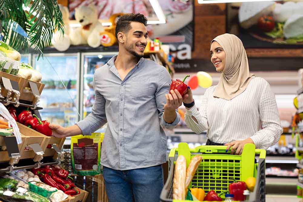 Couple shopping at carrefour for groceries