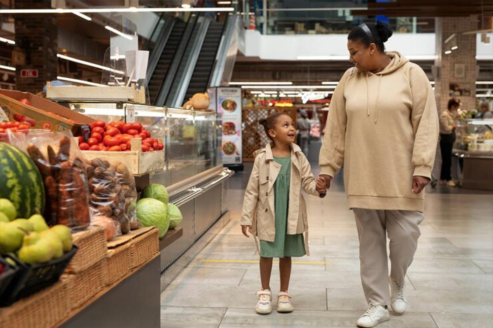 a women shopping groceries with her children at LuLu hypermarket in dubai 