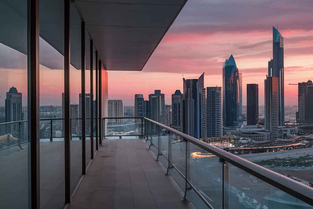 A modern apartment building in Abu Dhabi with neatly maintained balconies