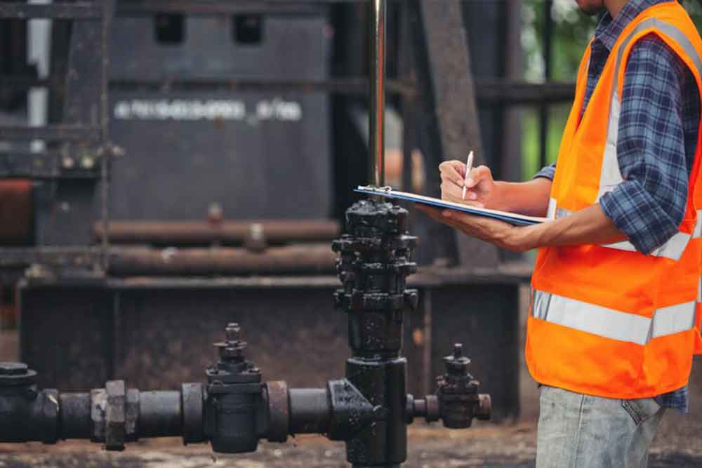 a worker noting the details for water connection in sharjah