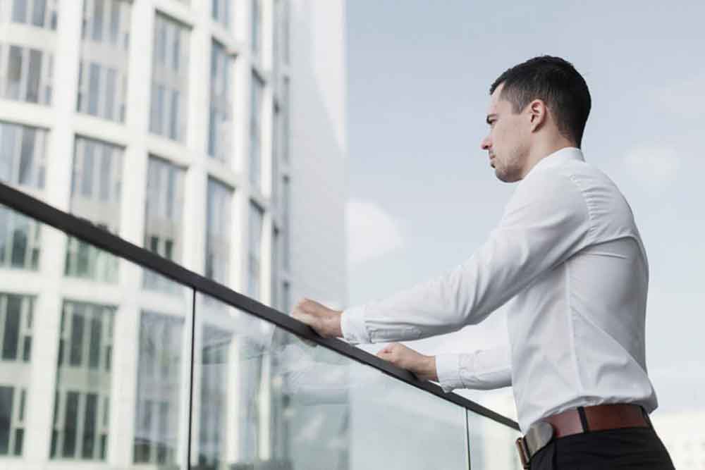 a man standing on the balcony 