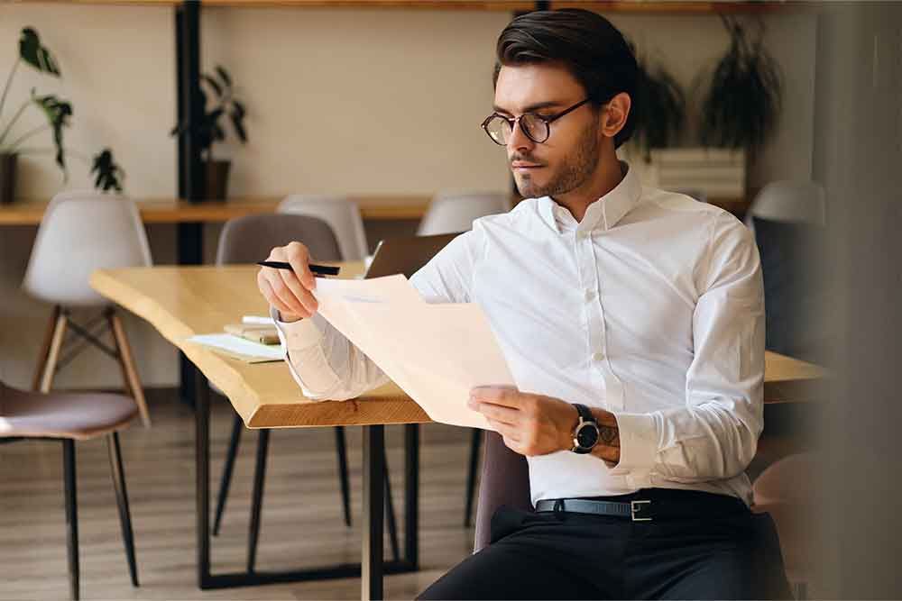 A man reading No-objection certificate in dubai