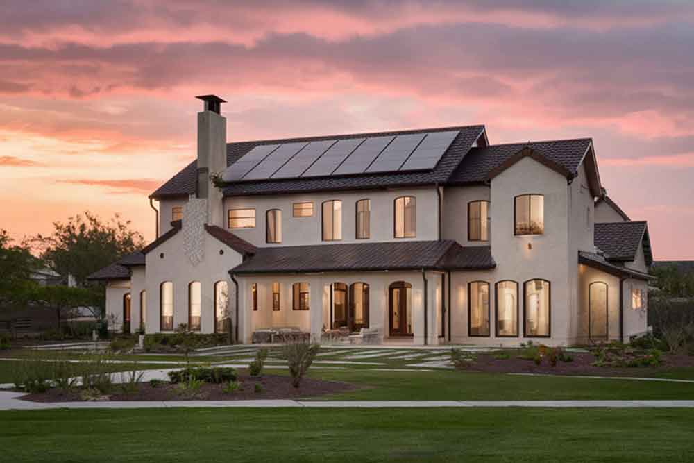 villa with solar panels on roof