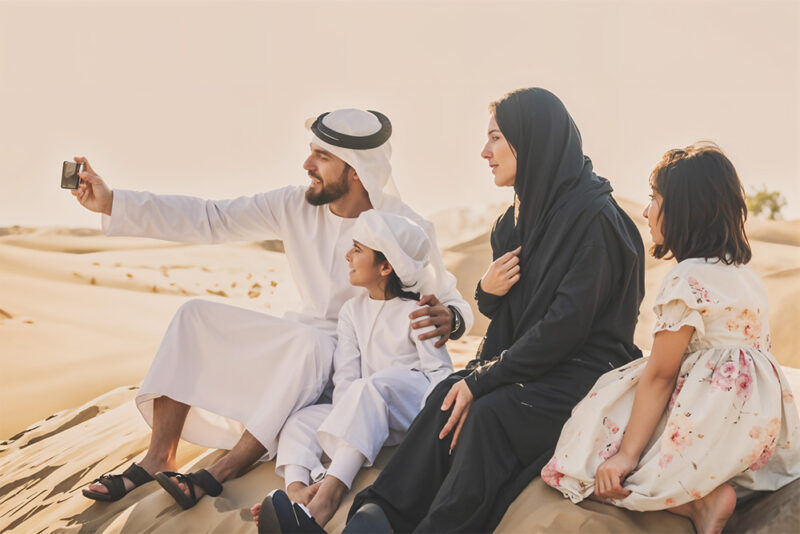 Family enjoying in deserts of Dubai