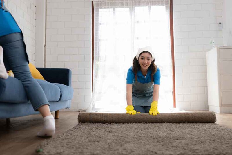 professional carpet cleaners taking your rugs for a wash