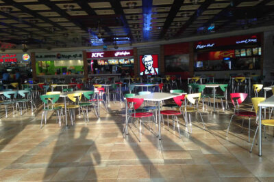 Image of a food court with colourful chairs