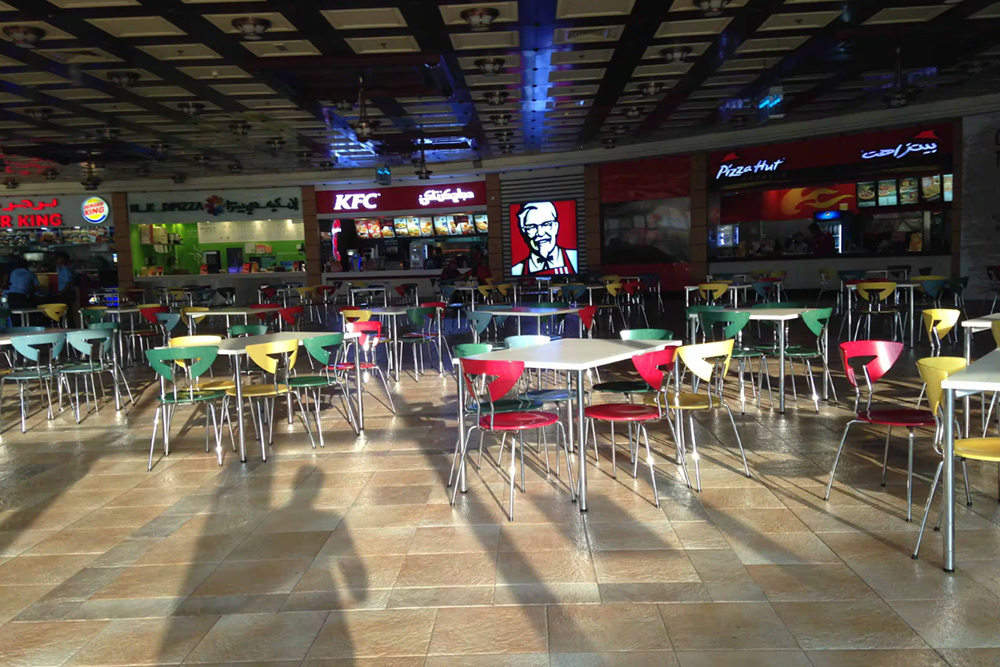 Image of a food court with colourful chairs