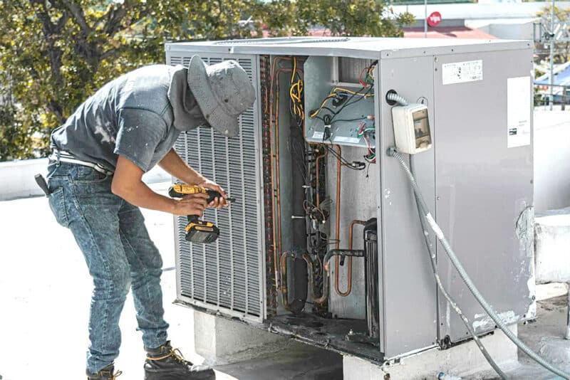 technician Repairing a Air Conditioner