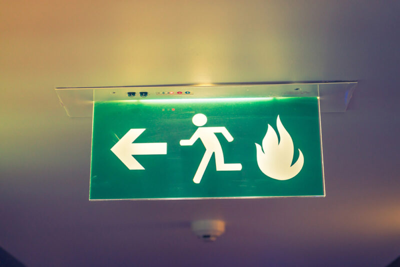 A sign showing the fire exit 