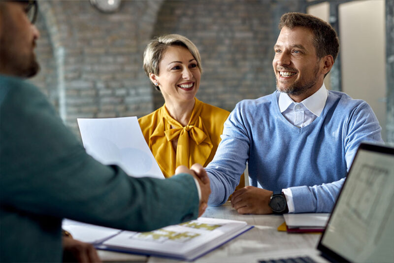 couple receiving home insurance documents 