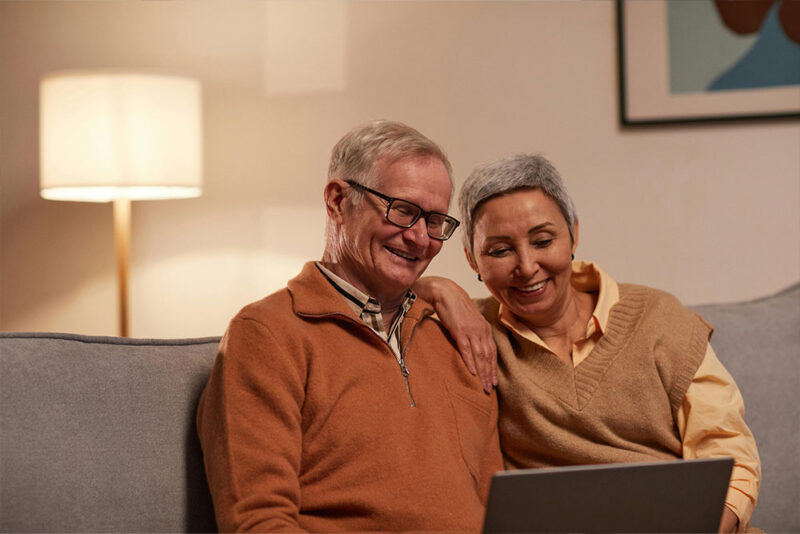 an old couple Checking the laptop 