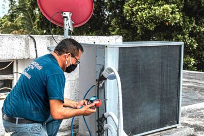 Man Checking an Air Conditioner