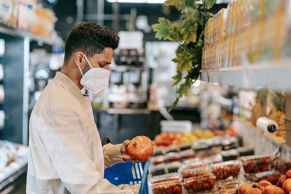 Man checking fruit 