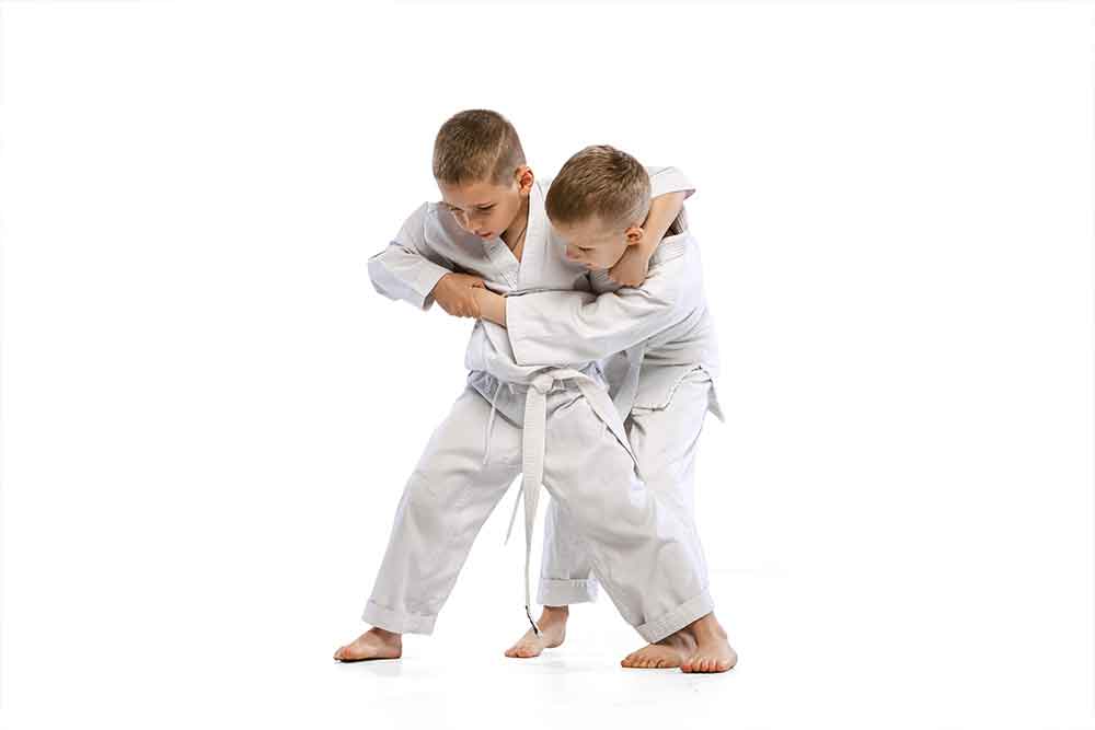 Kids practising karate actions in a class of karate in Abu Dhabi