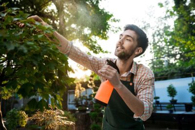 Man spraying plants