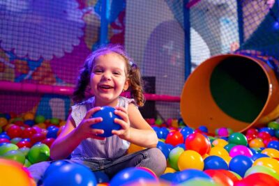 Colourful indoor play area with soft toys