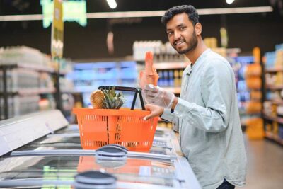 Man buying fresh fruits and meat from Union Coop supermarket in Dubai