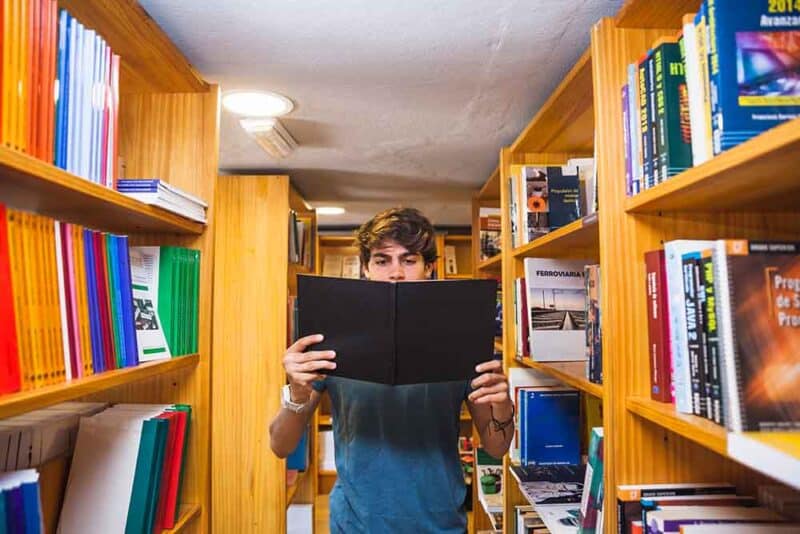 Man reading in library