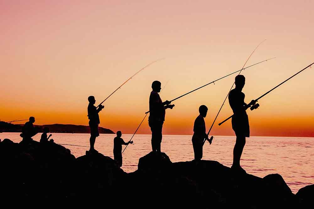 Fishing spot with a view of Abu Dhabi skyline at sunset