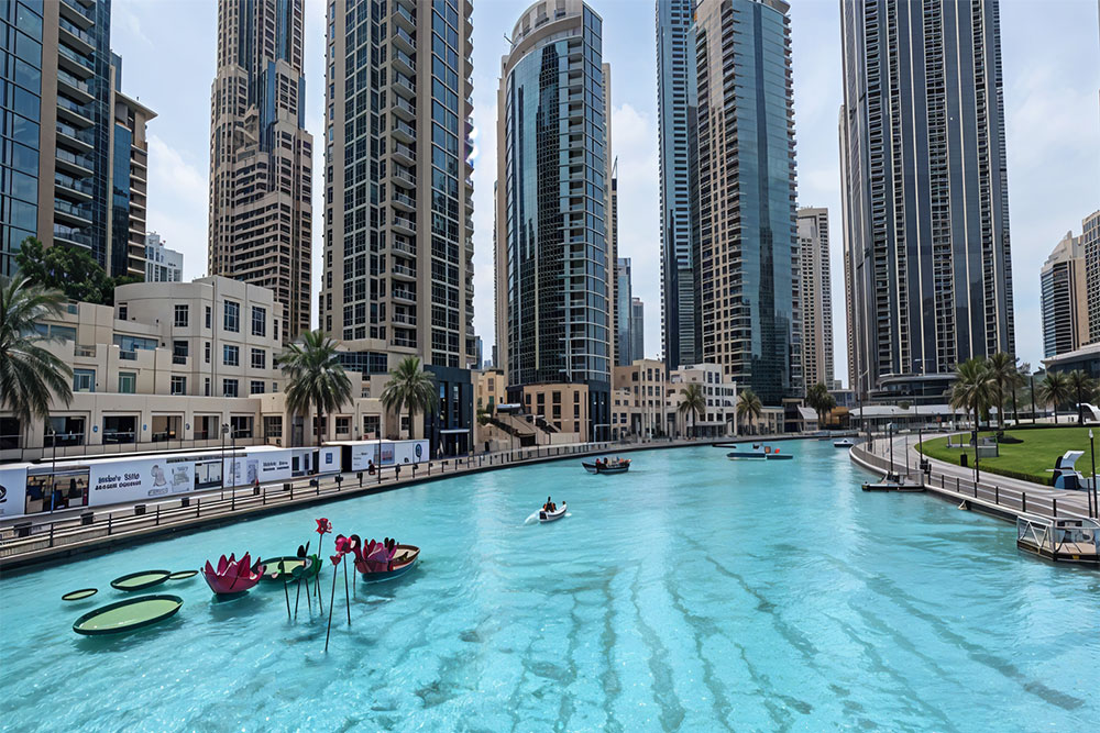 Blue waters with surrounding city buildings.