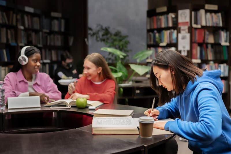 Girl writing in library