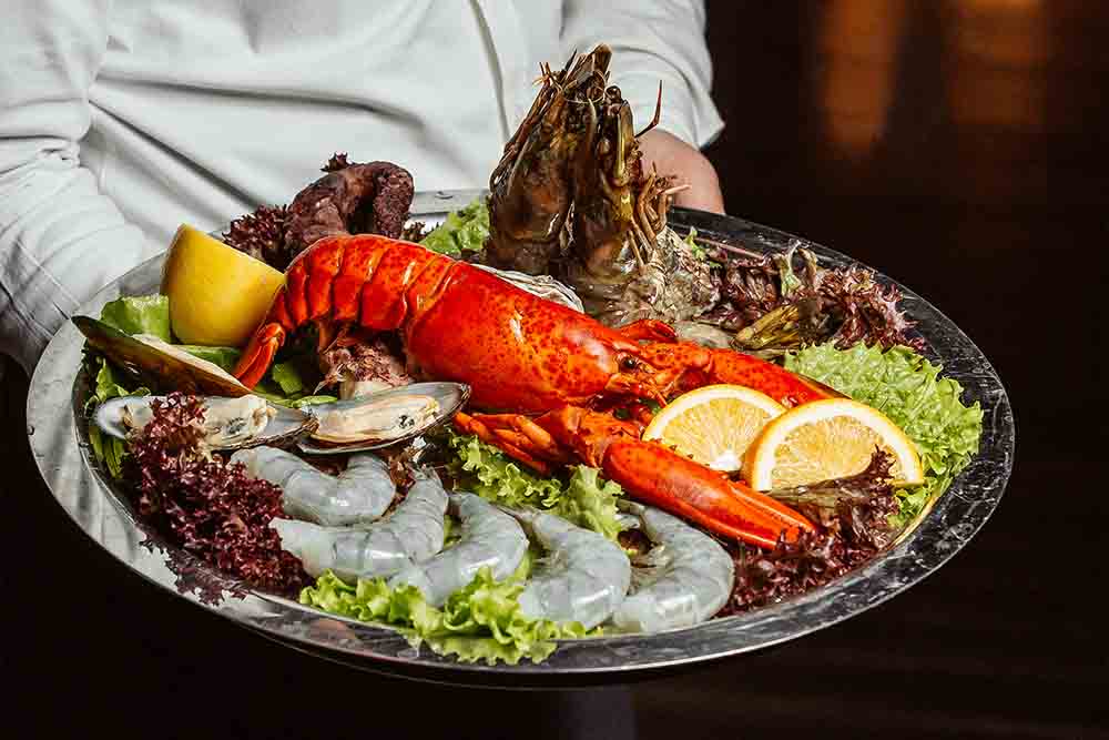 Platter of nicely decorated lobster seafood dish at Abu Dhabi restaurant