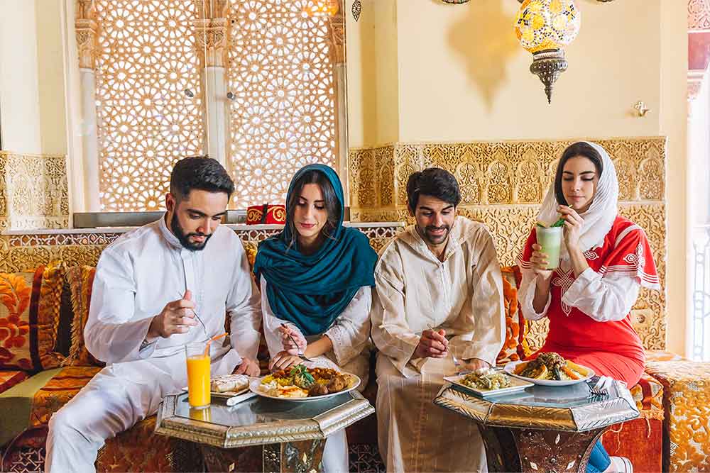 Lively atmosphere at a Dubai restaurant with people enjoying dinner