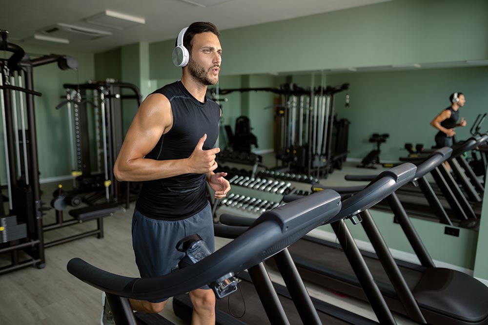 Gym member using treadmill in Fujairah gym 