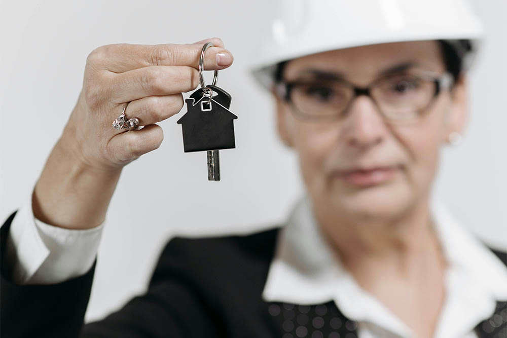 woman holding housekeys