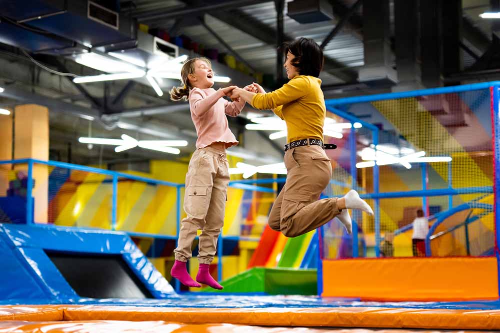 Parents and kids enjoying high jumps 