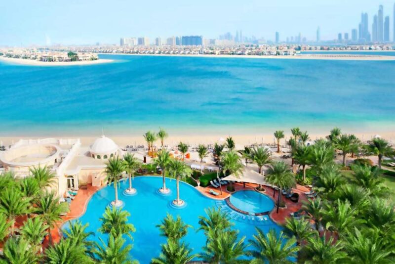 An image of a sea-facing resort with Dubai skyline 