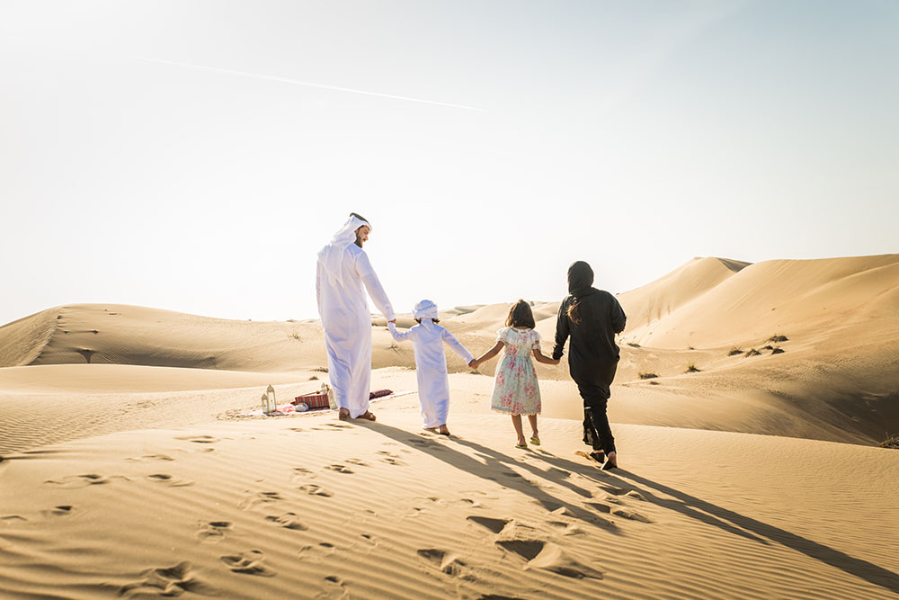 Family enjoying in deserts of Dubai
