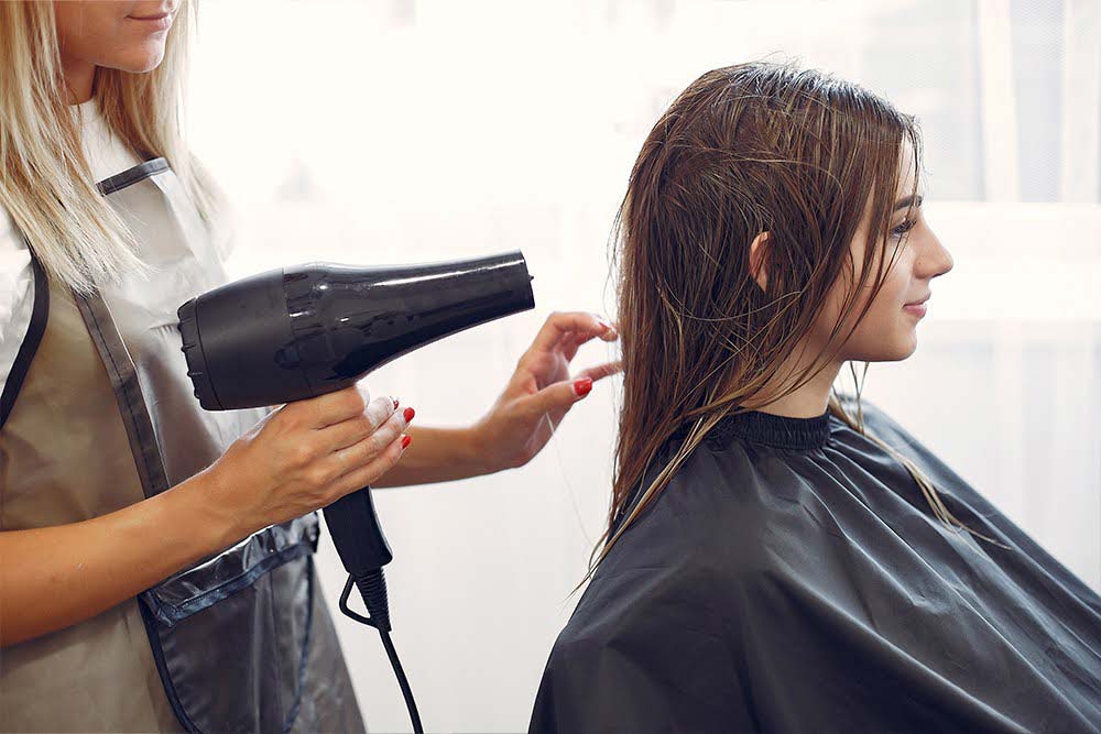 Stylist working at one of the best hair salons in Dubai