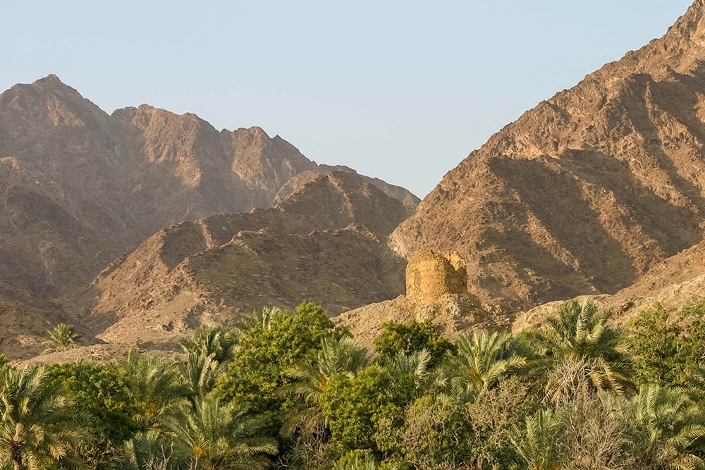 A view of rugged Hajar mountains with some greenery 