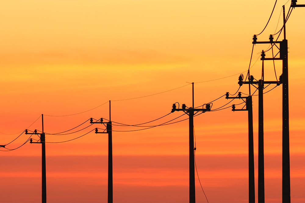 electric poles in sunset