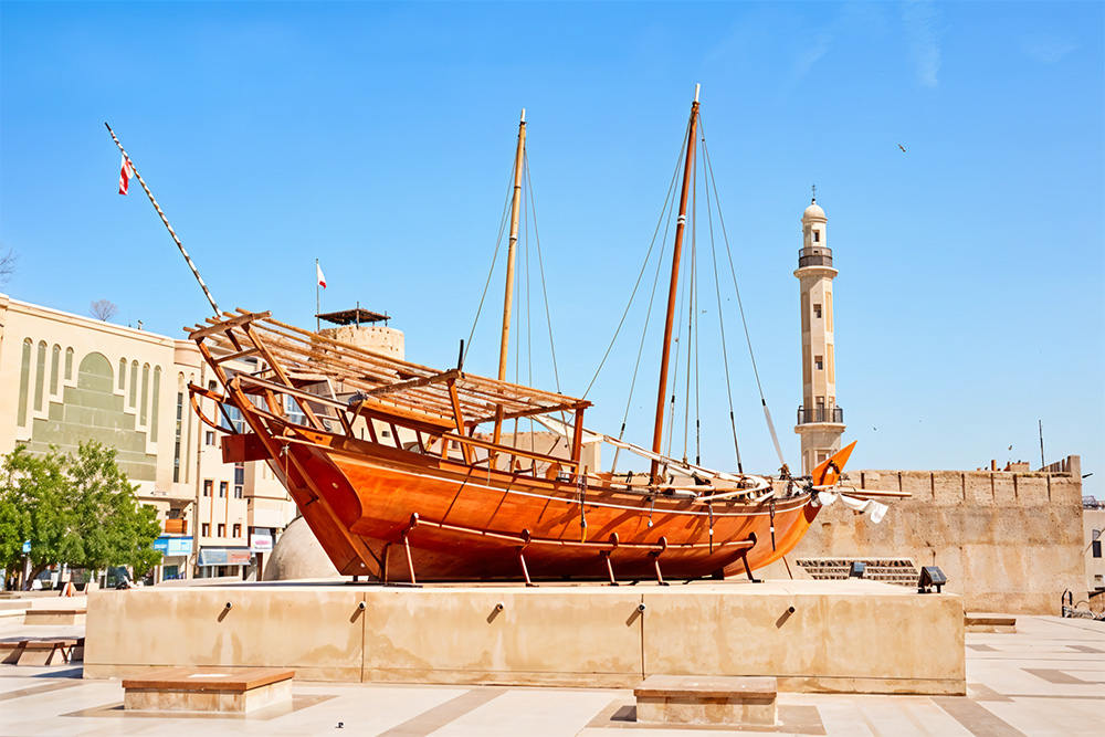 ship under a blue day sky in Ras Al Khaimah National Museum