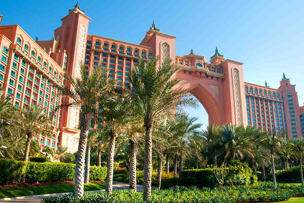 Beautiful view of resort with lots of palm trees around 